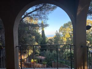 an archway in a building looking out at a view at La Casetta di Serenella in Andali