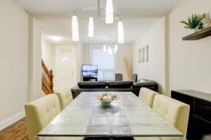 a dining room and living room with a table and chairs at JstLikeHome - Central Suite in Ottawa +26 photos
