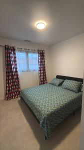 a bedroom with a bed and two windows at Porte de la Méditerranée in Perpignan +7 photos