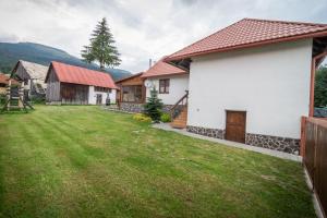 a view of a house with a yard at Modrý Dom - Telgárt Resort in Telgárt