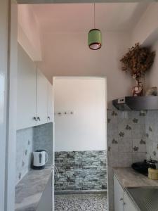 a kitchen with a sink and a counter top at Oasis in Loutrópolis Thermís +47 photos