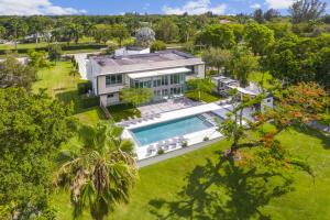 an aerial view of a house with a swimming pool at Luxury 9-Bedroom Villa in Southwest Ranches with Private Pool, Jacuzzi, and Movie Theater, Sleeps 20 in Miami