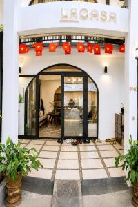 an entrance to a store with an open door at Lacasa Homestay in Hue