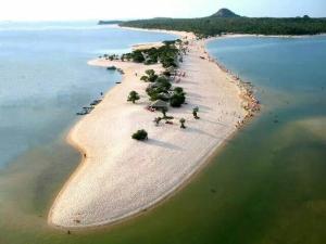 an aerial view of an island in the ocean at Pousada Caribe Amazônico Alter do Chão - 1 quarteirão da Orla de Alter in Alter do Chao