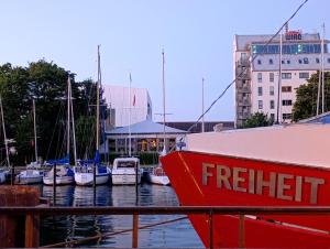 a group of boats docked in a marina at Dahai Ferienwohnung Seebad Warnemünde Schulstraße 1, OG in Rostock