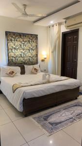 a bedroom with a large bed in a room at narayana regency in Ludhiana