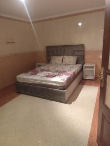 a bedroom with a bed in a room at Aroui aireport in Nador Airport