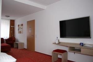 TV a/nebo společenská místnost v ubytování Hotel Petersen