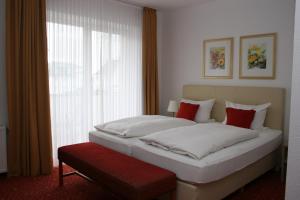 Postel nebo postele na pokoji v ubytování Hotel Petersen