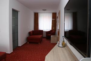 TV a/nebo společenská místnost v ubytování Hotel Petersen