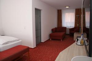 Postel nebo postele na pokoji v ubytování Hotel Petersen