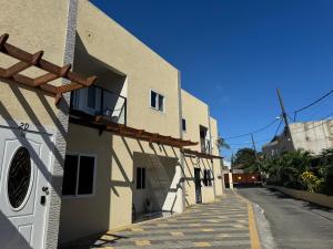 a building with a washing machine on the side of it at Elegant 3-Bedroom Loft Condo in Kingston
