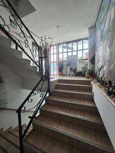 a staircase in a house with wooden floors at Hotel Los Balcones in San Agustín