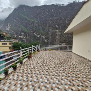 a balcony with a view of a mountain at Inder's Heritage in Bangīna +8 photos