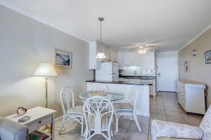 a kitchen and living room with a table and chairs at Beachwood Place 3E in Hilton Head Island
