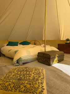 a bedroom with two beds and a tent at Slane Concert - Riverside Glamping in Navan