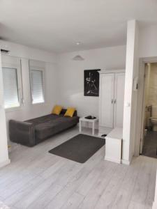 a living room with a large bed in a room at Tanja Apartment in Podgorica