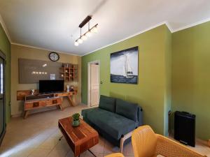 a living room with a couch and a table at Casa Katrine in Lakíthra