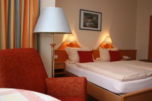 Postel nebo postele na pokoji v ubytování Hotel Petersen