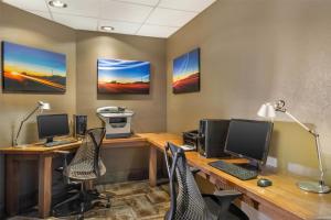 an office with two desks with computers and chairs at Best Western Plus Scottsdale Thunderbird Suites in Scottsdale +39 photos