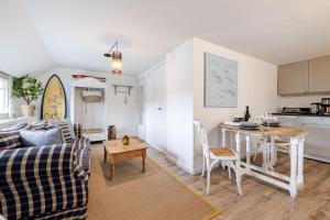 a living room with a couch and a table at Beachday Kampen in Kampen +24 photos