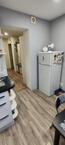 an empty room with a washer and dryer in it at Homestay Ezerkrasts in Liepāja +3 photos