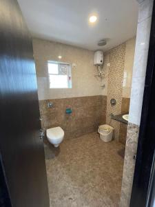 a bathroom with a toilet and a sink at Triyaah Pool View Studios Arpora, Goa in Arpora +26 photos