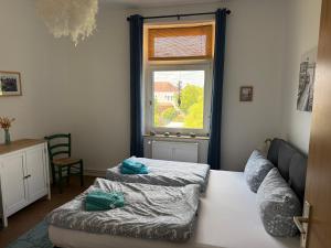 a living room with a couch and a window at Crampas 1 in Sassnitz
