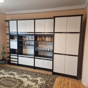 a large white closet with black and white doors at Samu lakóház in Balatonberény