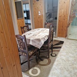 a dining room table with a table cloth on it at Samu lakóház in Balatonberény +1 photo