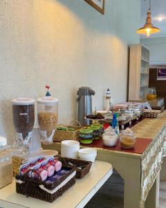 a kitchen with a counter with some food on it at Hotel Palmas de La Serena in La Serena