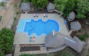 an overhead view of a swimming pool in a yard at Musituni Luxury Villas in Diani Beach
