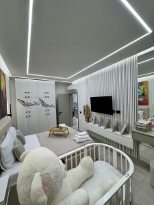 a bedroom with a teddy bear sitting on a crib at Marevista Escape in Golem