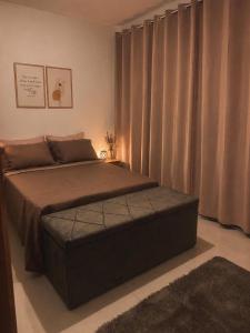 a bedroom with a large bed with a large window at Casa dos bons encontros in Santa Isabel +41 photos