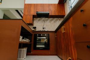 an overhead view of a kitchen with wooden cabinets at Residence Cottages in Morogoro