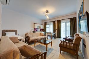 a living room with a couch and a table at Lagoonia Sun Hotel in Fethiye