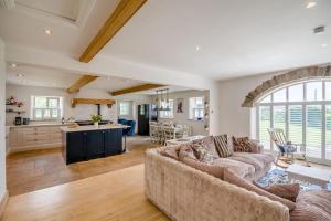 a living room with a couch and a kitchen at 7 Bed in Langbar oc-d34075 in Middleton