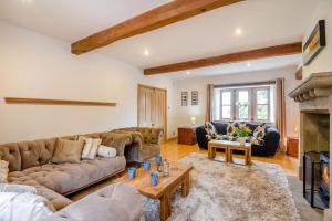 a living room with a couch and a fireplace at 7 Bed in Langbar oc-d34075 in Middleton