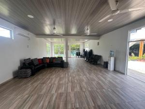 a living room with a couch and chairs in it at Casa Finca pasadia cerete in Cereté