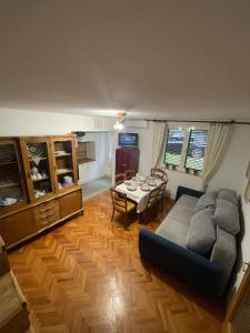 a living room with a couch and a table at Holiday House Bribir in Bribir