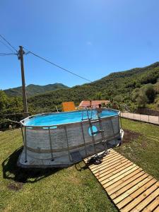 a small boat sitting on a wooden deck at Câ de Bacî in Vessalico