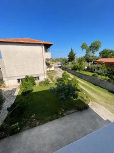 an aerial view of a house with a yard at Tale Breeze Apartments in Tale +14 photos