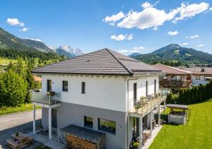 an aerial view of a house with mountains in the background at Mountain Chalet Bergblick Top 2 in Fieberbrunn