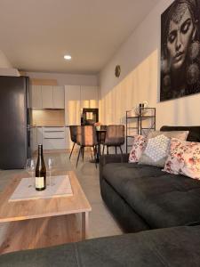 a living room with a couch and a table at Panoráma apartman in Dolný Čepen