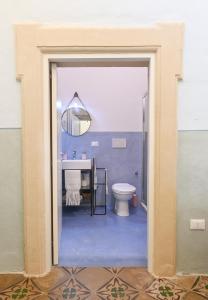 a bathroom with a toilet and a sink at Dimora San Vito in Lequile +52 photos