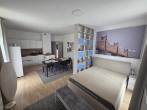 a room with a bed and a dining room at Dolce Vita Harrachov in Harrachov +22 photos
