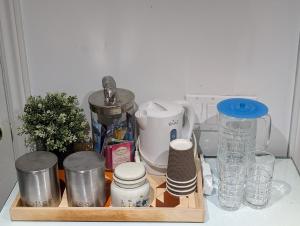a tray with a bunch of items on a counter at King Size In-Suite Basement in Toronto