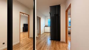 an empty room with a hallway with a mirror at Targówek Home in Warsaw