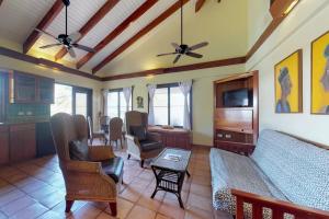 a living room with a couch and a table at Condo #22 @ Beachside Villas in Seine Bight Village