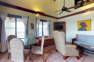 a dining room with a table and chairs at Condo #22 @ Beachside Villas in Seine Bight Village